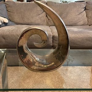 Silver bookcase decor piece